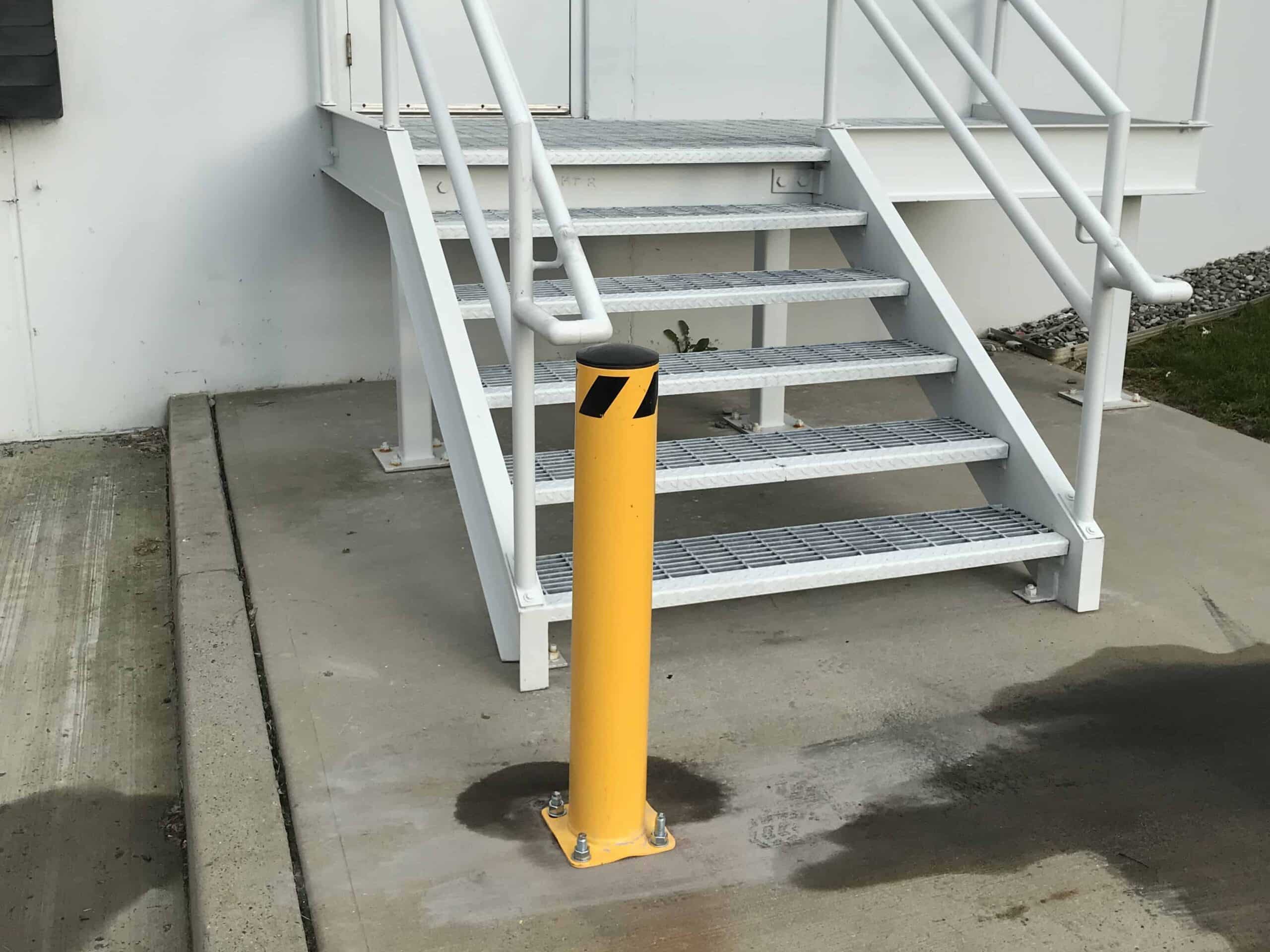 Heavy-duty bollards installed at a commercial property in the Tri-State area to prevent vehicle intrusion and enhance safety.