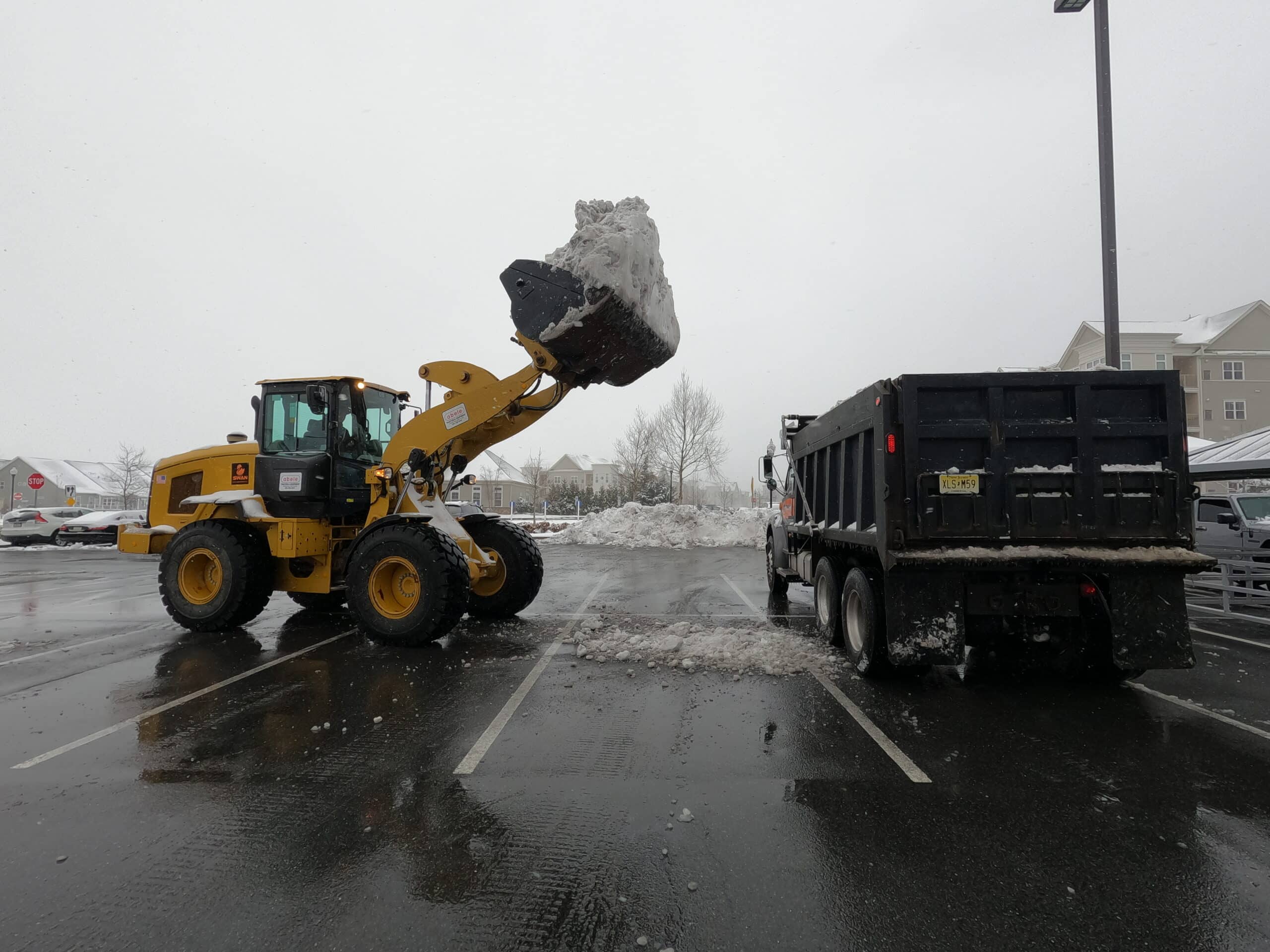 Swan Co. provides expert snow relocation services in the Tri-State area, helping businesses remove excess snow to prevent hazards and maximize space.