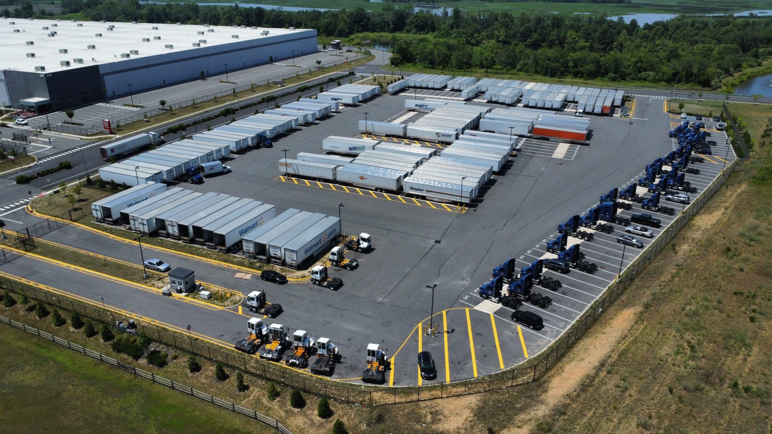 Clean blacktop surface with finished striping across trailer rows and traffic zones.