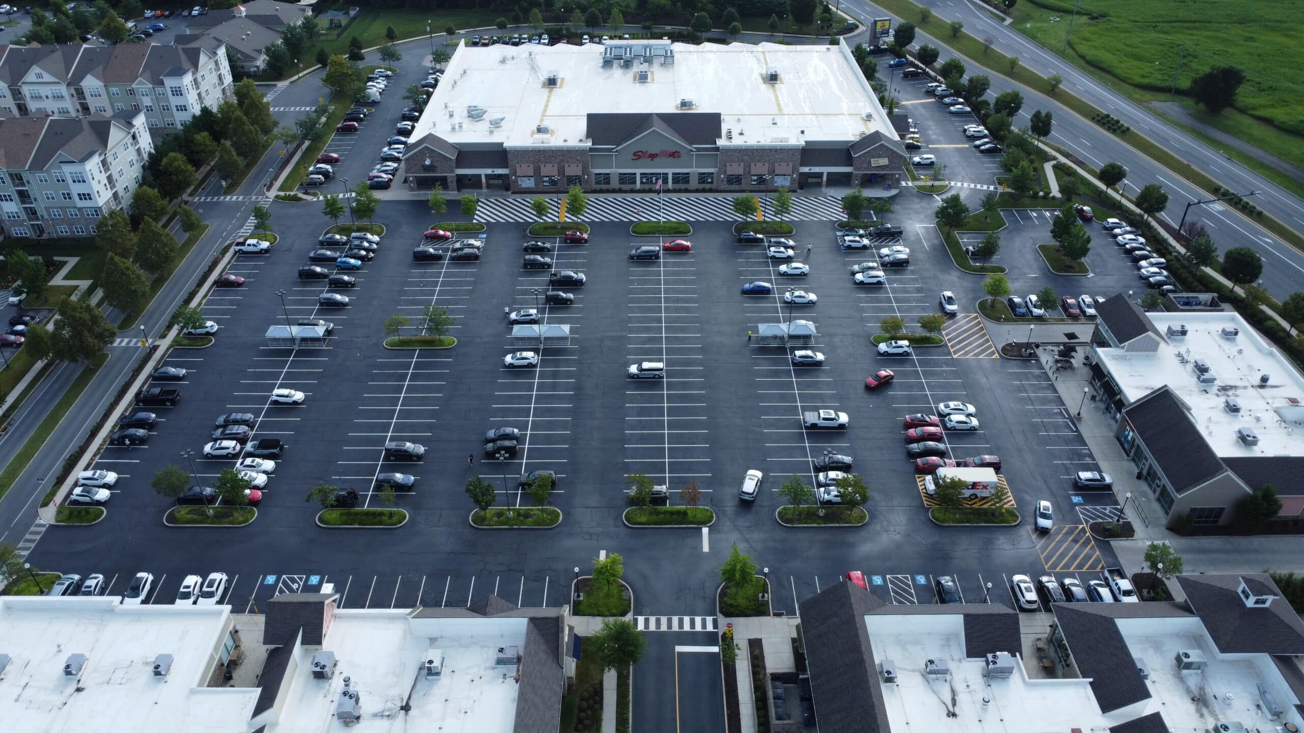 Parking lot at Bethlehem, PA retail center restored with crack sealing, sealcoating, and new pavement markings by Swan Co.