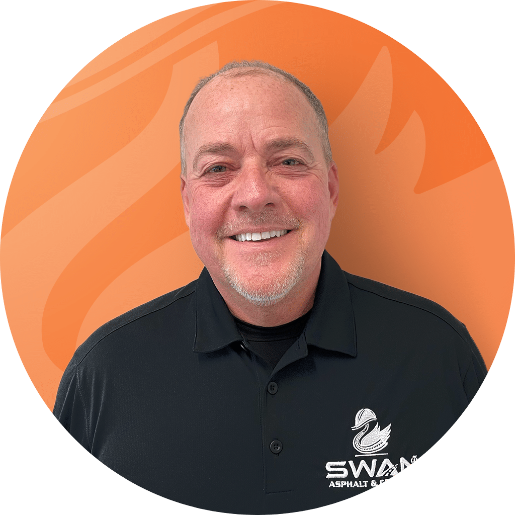 Rodney Heft, Client Solutions Specialist at Swan Co, smiling in a black Swan Asphalt & Concrete polo.